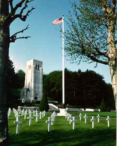Aisne-Marne American Cemetery with aligned white headstones and a memorial chapel.