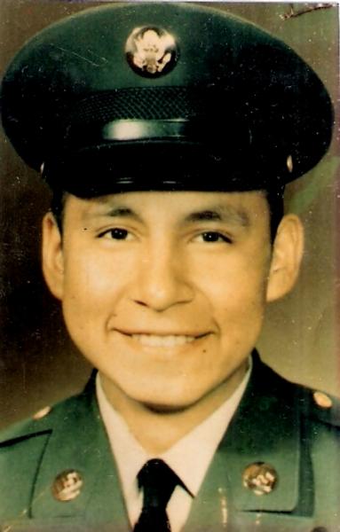 The image shows a formal military portrait of a young service member in a United States Army dress uniform
