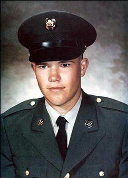 U.S. Army portrait of a service member wearing a dark green dress uniform with the U.S. Army eagle insignia.