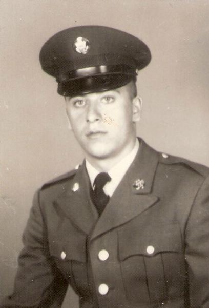 vintage black‑and‑white military portrait showing a service member posed formally