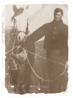 Morris Brandvik leading a horse.