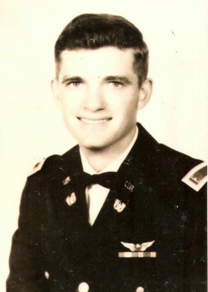 This portrait shows a young U.S. Army Air Forces officer in a formal studio photograph.