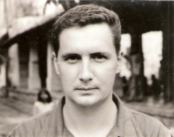 This is a vintage black‑and‑white close‑up portrait of the veteran.  It appears to be taken while serving in Vietnam.