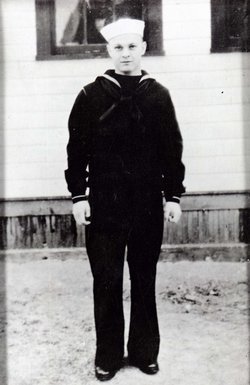 Fireman First Class Charles Ray Casto in uniform standing photo