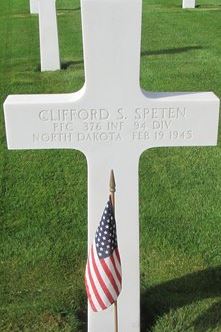 Private First Class Clifford S Speten cross grave marker photo with small American flag photo