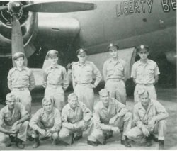 Second Lieutenant Cyril E Eustis with ten other service members in front of aircrafts photo