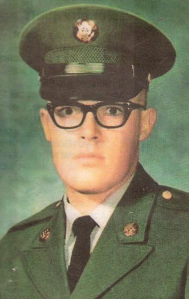 This is a formal studio portrait of a U.S. Army service member, presented in the classic style used for official military photographs from the mid‑20th century through the early 1980s.