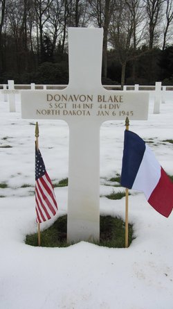 Staff Sergeant Donavon Blake cross grave marker with small flags photo