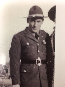 Private Roy J Eckert in uniform standing black and white photo