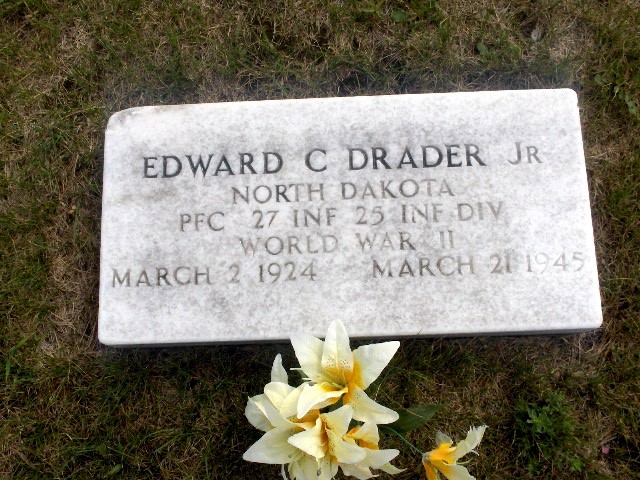 Private First Class Edward C Drader Jr. grave marker with yellow flowers photo