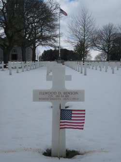 Corporal Ellwood D Benson cross grave marker with small flag photo
