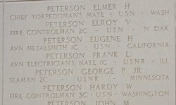 Fire Controlman Second Class Elroy V Peterson's name inscribed on memorial with several other names photo