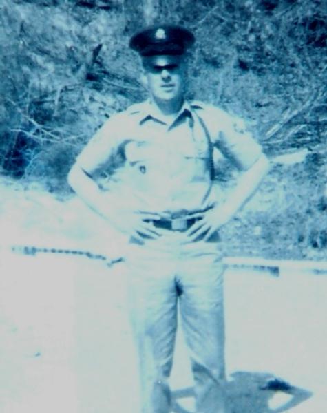Staff Sergeant Ward Cecil Evans photo is outdoors in a military uniform.