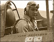 Lieutenant Junior Grade Francis Register in uniform sitting in aircraft photo