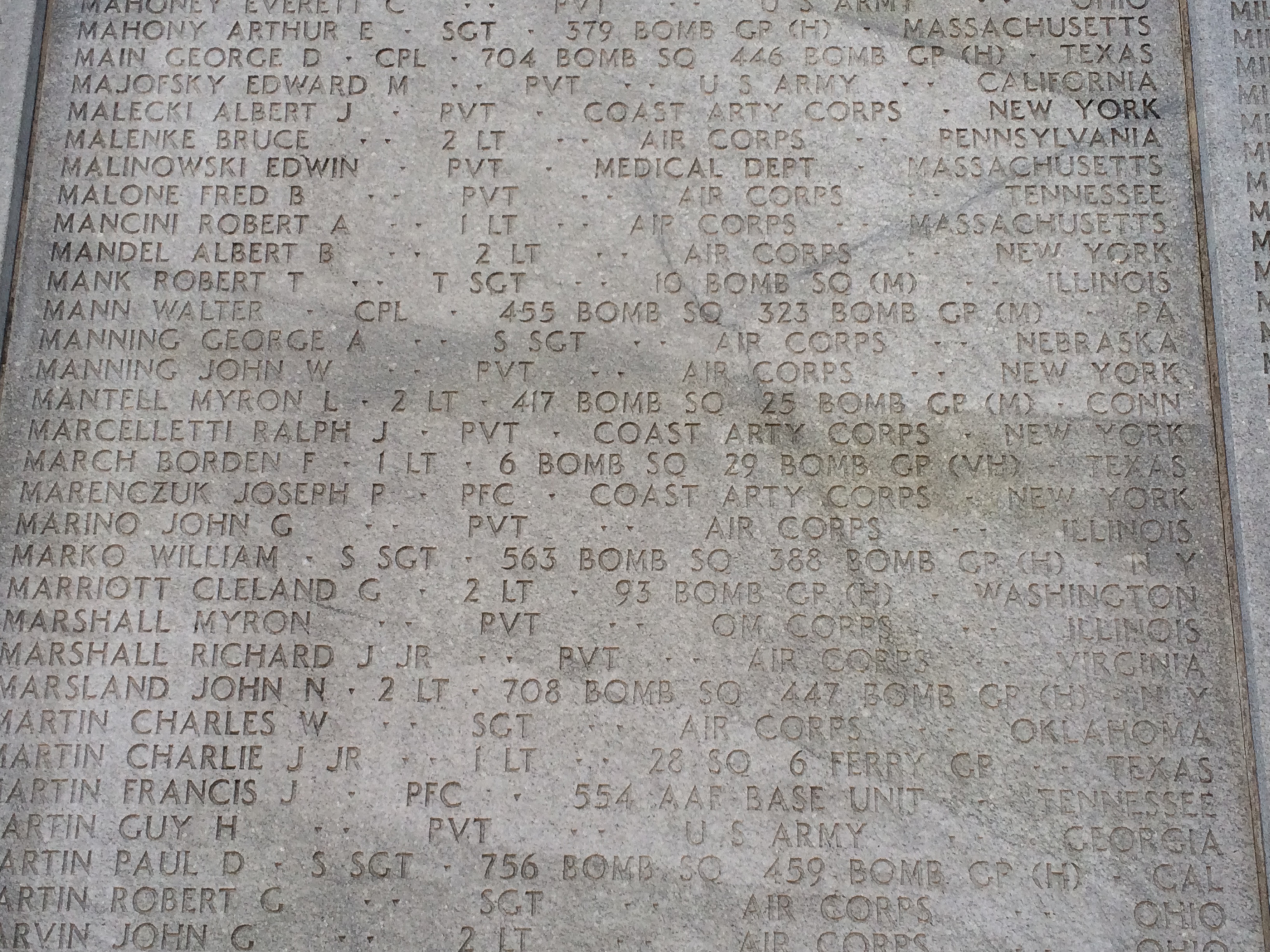 Staff Sergeant George A Manning's name in memorial wall with many other names photo