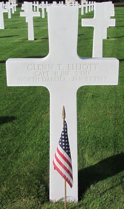 Captain Glenn T Elliott cross grave marker with small American flag photo