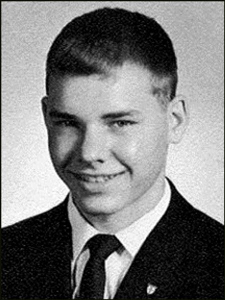 Warrant Officer Steven Reed Hanson black and white photo, he is dressed formally in a suit and tie.