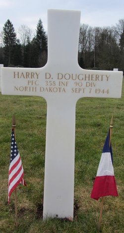 Private First Class Harry D Dougherty grave marker with small flags photo