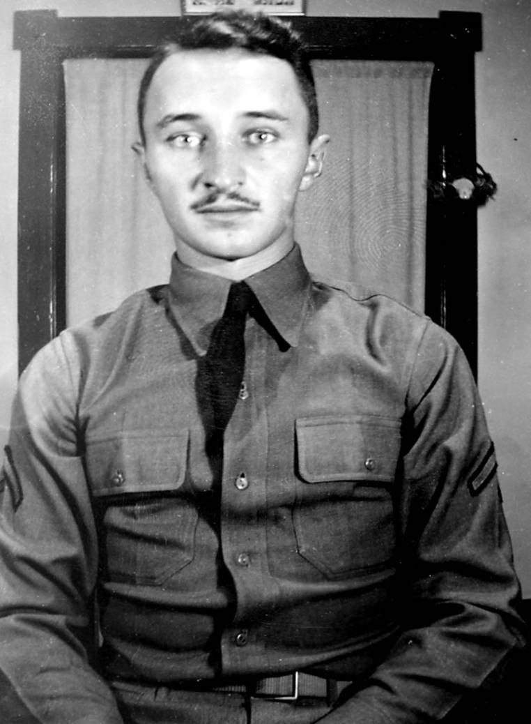 Corporal Herman C Diede in uniform sitting black and white photo