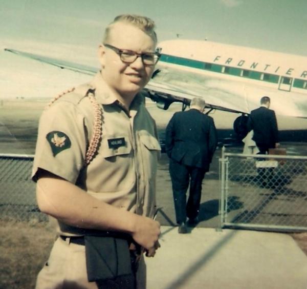 Richard Hovland photo in uniform standing at what appears to be preparing to board an airplane.