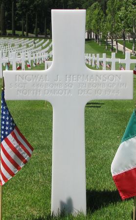 Staff Sergeant Ingwal J Hermanson cross grave marker with small flags photo