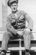 Staff Sergeant Kenneth A Klose in uniform sitting on stairs photo