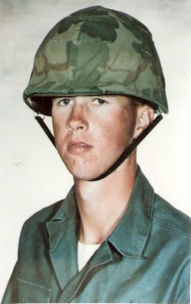 Allan James Korom photo in Marin Corps uniform wearing a combat helmet.