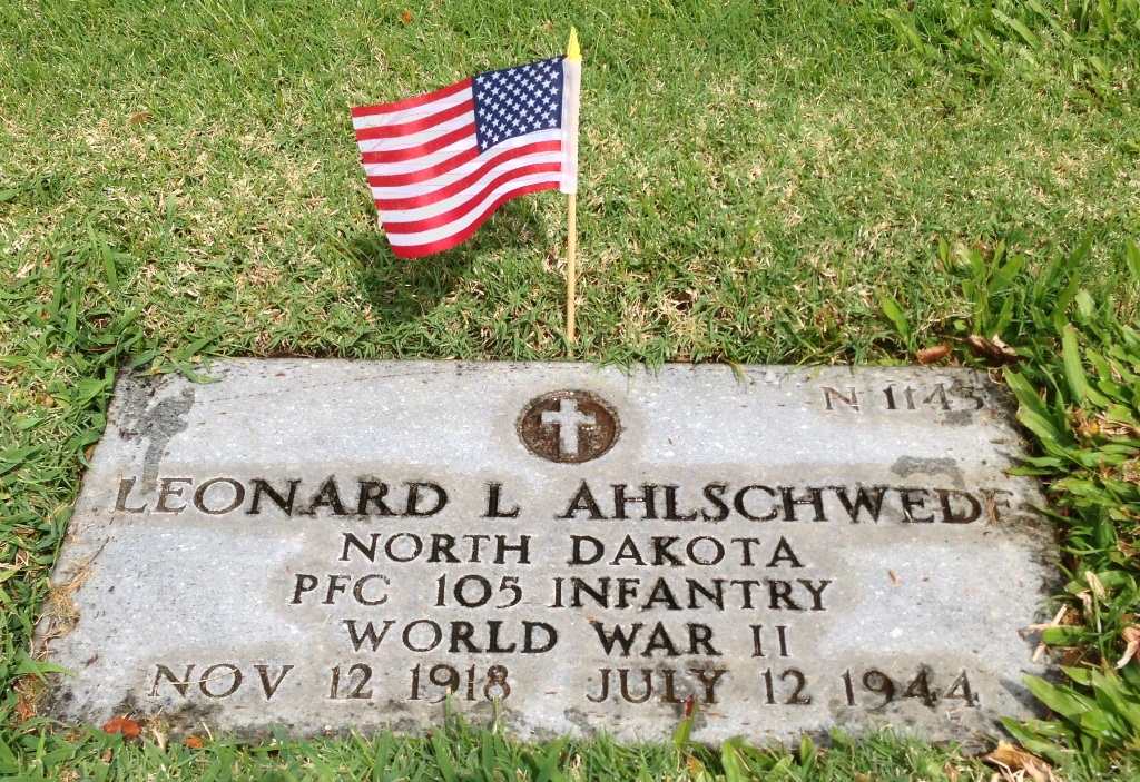 Private First Class Leonard L Ahlschwede grave marker with American flag photo