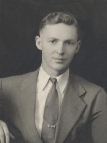 Aviation Ordnanceman Second Class Leonard W Nicholson in suite and tie photo