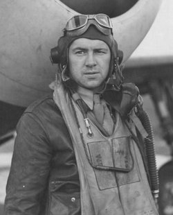 First Lieutenant Leroy W Ista in uniform standing in front of airplane photo