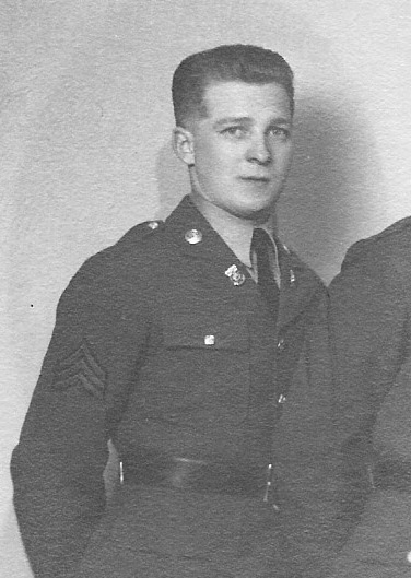 Staff Sergeant Lester W Puppe in uniform standing photo