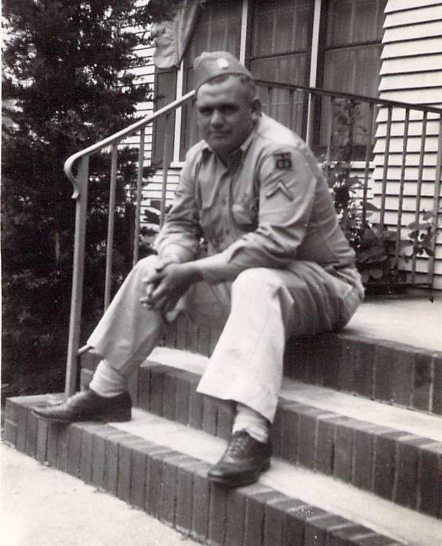 Sergeant Lloyd Juell Wedwick in uniform sitting on steps photo