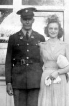 Sergeant Oliver A Indergaard in uniform standing with spouse photo