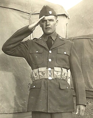 Sergeant Paul S Johnson in uniform saluting photo