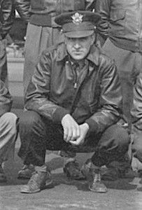 First Lieutenant Rudolph L Jenson in uniform squatting down photo