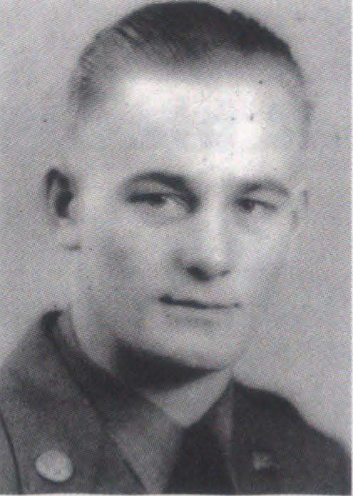 A black‑and‑white portrait of Staff Sergeant Miles Shelley in a formal military uniform photo