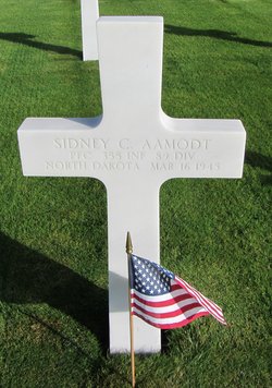 Private First Class Sidney Aamodt cross grave marker with small American flagphoto