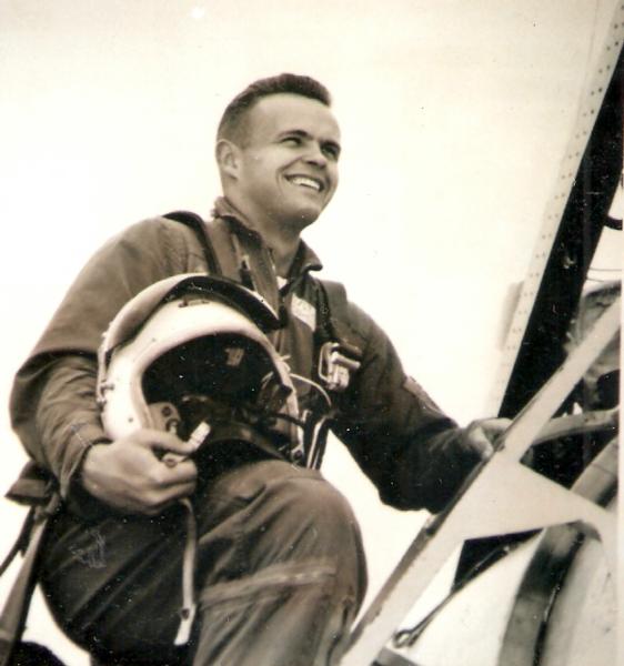 Martin Steen photo in pilot uniform on ladder entering into an aircraft
