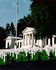 Suresnes American Cemetery overlooking Paris, with rows of white headstones on terraced lawns.