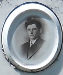 Vintage oval portrait of Willie Willprecht in a dark suit.