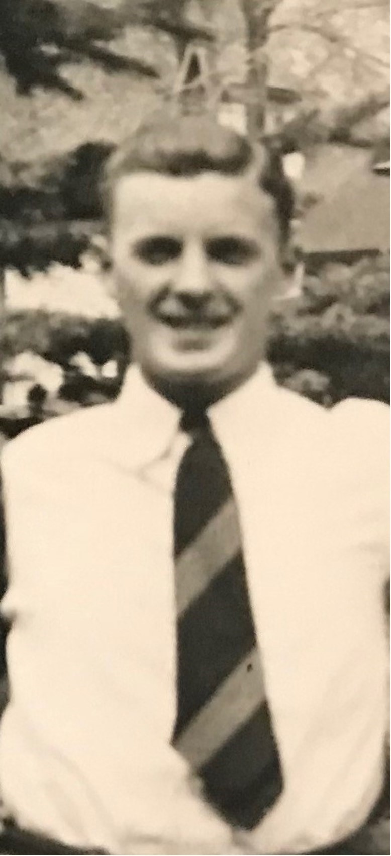 First Lieutenant William H Magill Jr in civilian clothes white shirt and tie photo