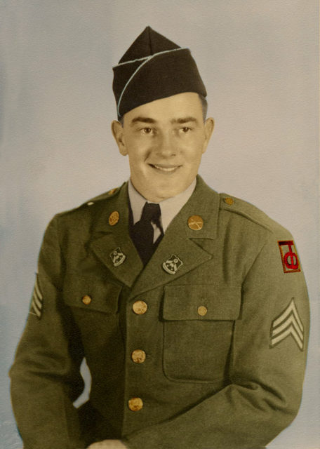 Sergeant William F Henrichs in uniform sitting photo
