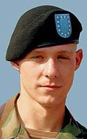 Paul Beyer wearing a Battle Dress Uniform and a black beret with blue flash