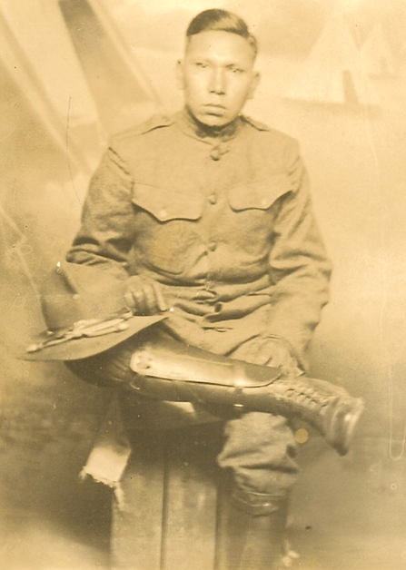 Richard Blue Earth seated in uniform.