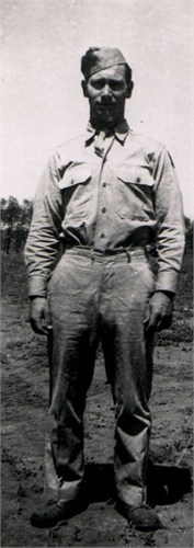 Private First Class Elwood M Patterson in uniform standing photo