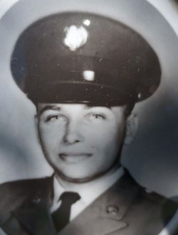This is a black‑and‑white formal military portrait showing a service member in a classic mid‑20th‑century dress uniform.