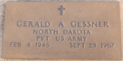 Photo of Gerald Gessner's grave marker set into the ground.