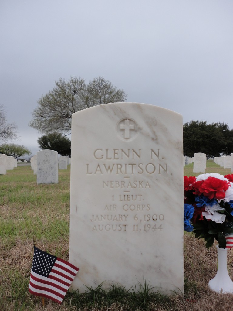 First Lieutenant Glenn N Lawritson grave marker with small flag and flowers photo