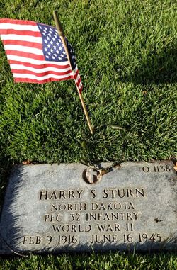 Private First Class Harry S Sturn grave marker with small American flag photo