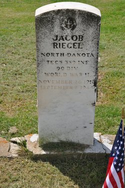 Technician Fifth Grade Jacob Riegel grave marker with small American Flag photo